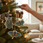 Mellow Monkey handmade beaded insect ornaments with sequins hanging on a Christmas tree branch