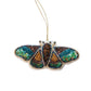 Mellow Monkey handmade beaded moth ornament with iridescent sequins and cotton fabric in brown, green, and blue.