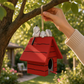 Mellow Monkey hand-painted resin beagle birdhouse featuring a white dog on a red roof hanging from a tree branch