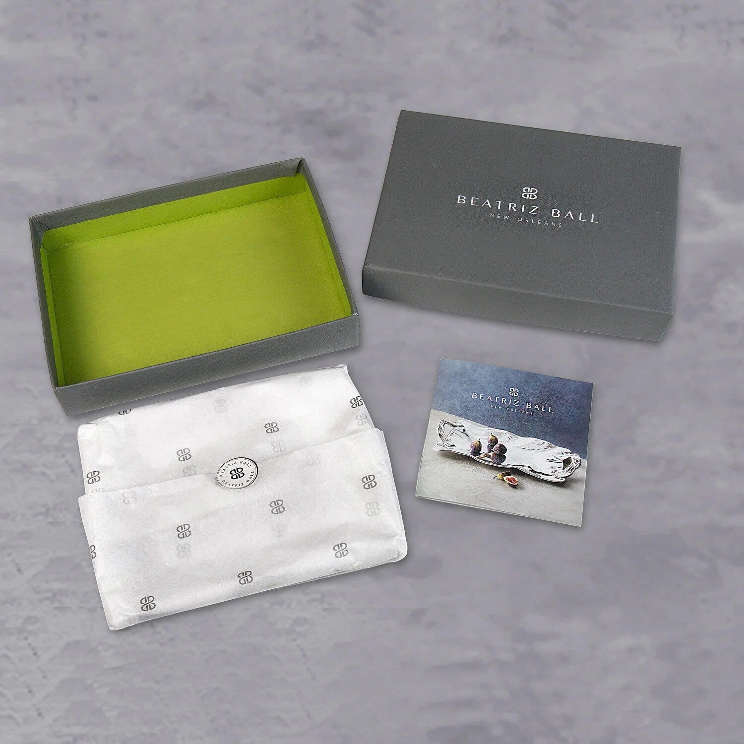 Beatriz Ball silver oyster bowl, handmade of aluminum alloy, presented in gift packaging with a product card.