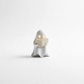 Mellow Monkey beige ghost figurine reading a book with an illuminated LED tealight candle inside
