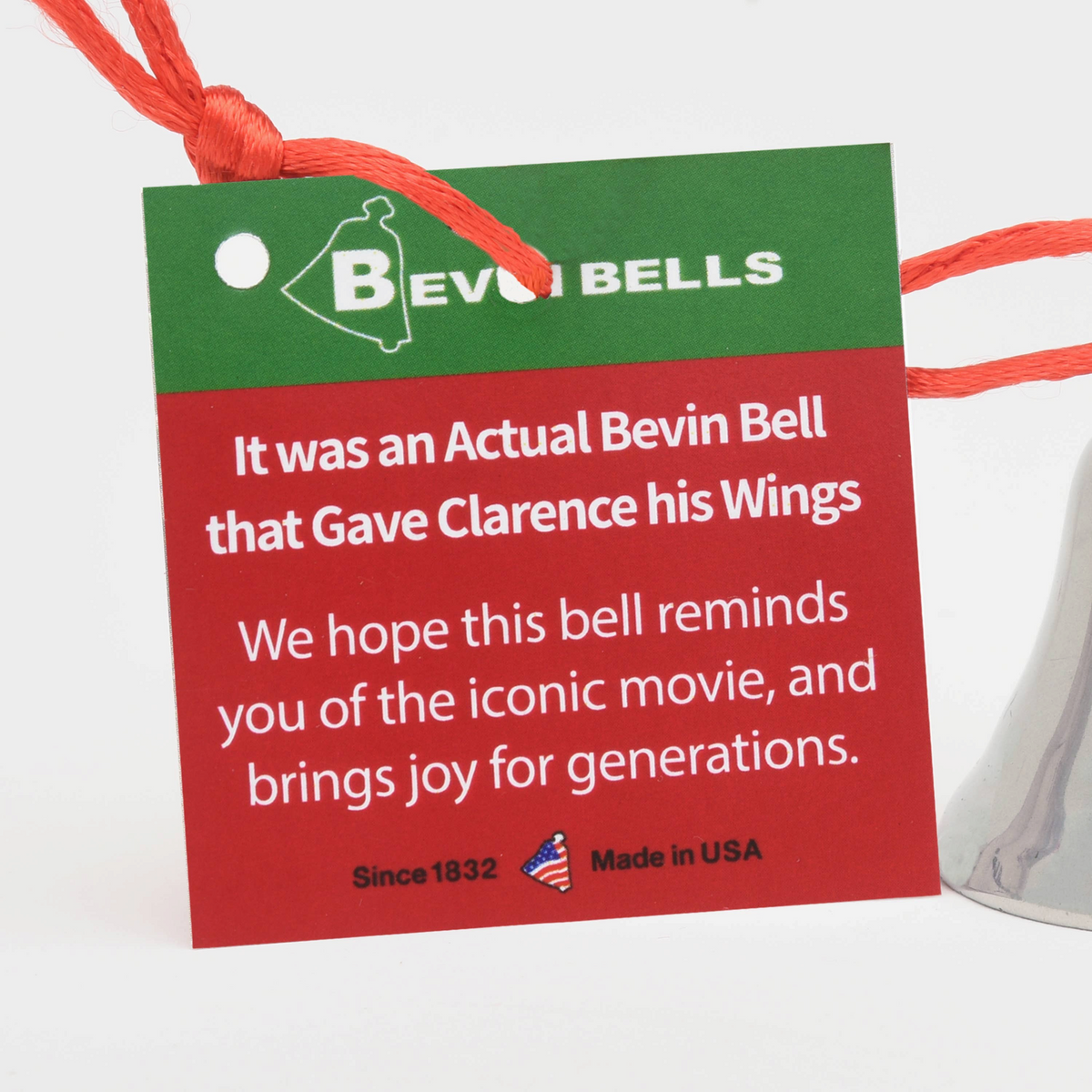 Mellow Monkey It's a Wonderful Life Bevin Bell ornament tag with red satin cord and silver bell detail