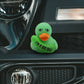Mellow Monkey green rubber duck with an orange beak holding a pickle with the text I am a big dill on a car bumper
