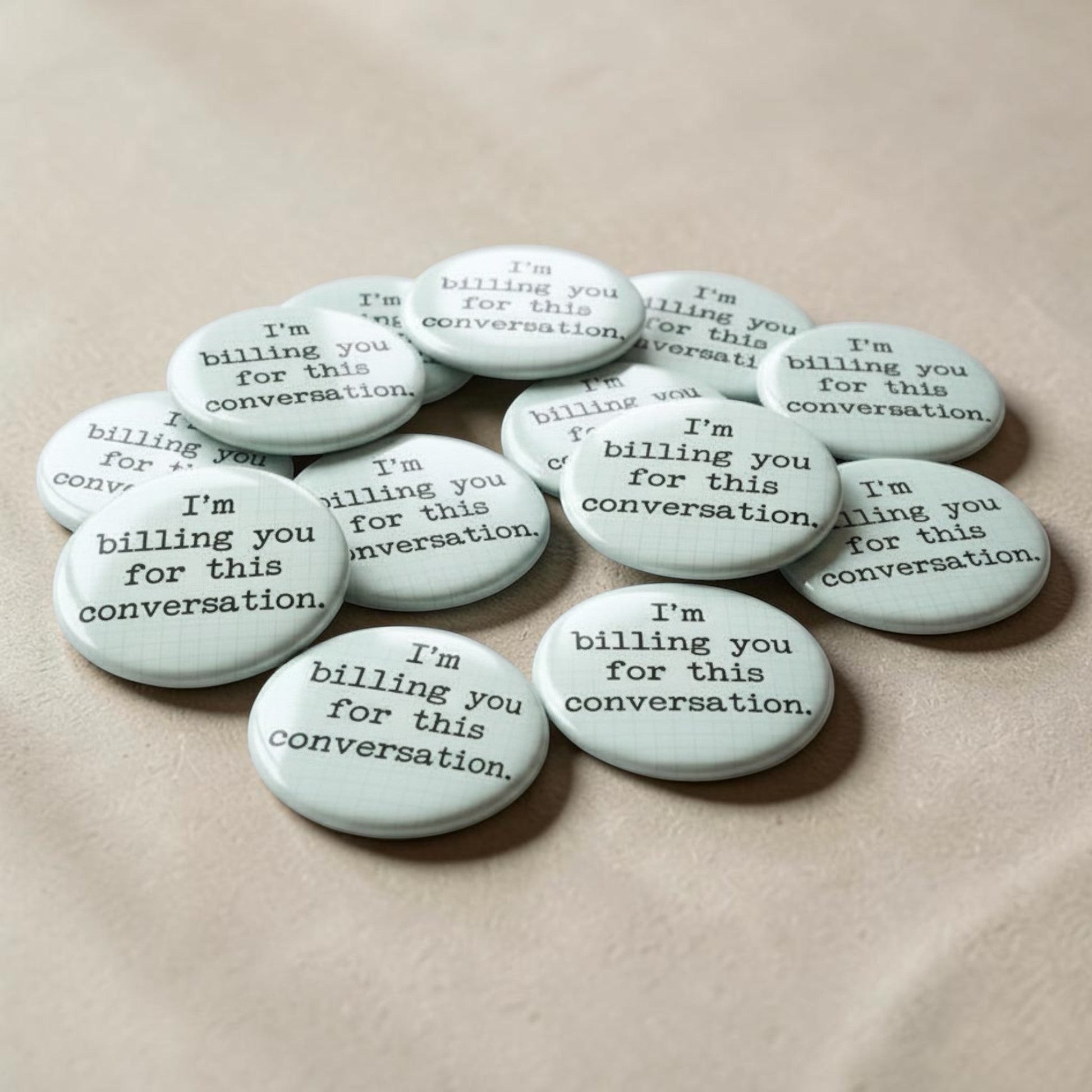 Mellow Monkey 1.25 inch round pin-back button with white grid background and black text I'm billing you for this conversation.