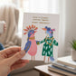 Mellow Monkey Birds of a Feather greeting card with whimsical bird illustration and gold foil birthday message