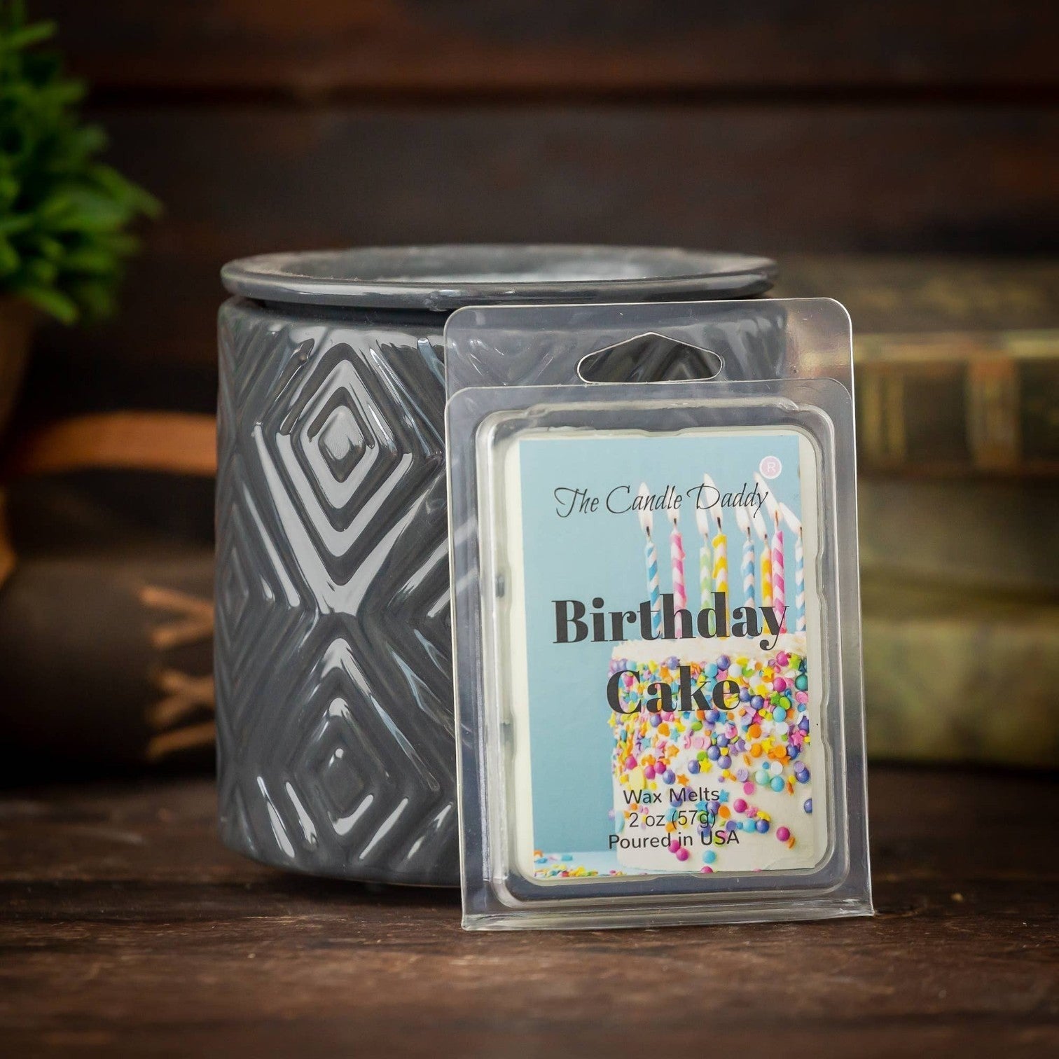 Mellow Monkey Birthday Cake scented wax melt, a white cake with colorful sprinkles and lit candles.