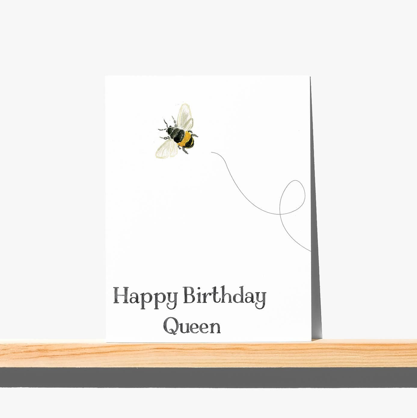 Mellow Monkey Happy Birthday Queen greeting card with bee art and blank interior. 4.25" x 5.5" card on FSC-certified paper.