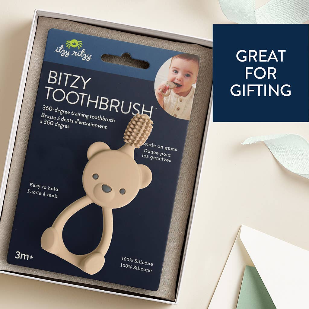 Mellow Monkey Bitzy Toothbrush in beige silicone with 360-degree bristles and a cute bear-shaped handle in packaging.