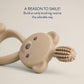 Mellow Monkey Bitzy 360-degree silicone training toothbrush in beige with a cute bear-shaped handle for babies.