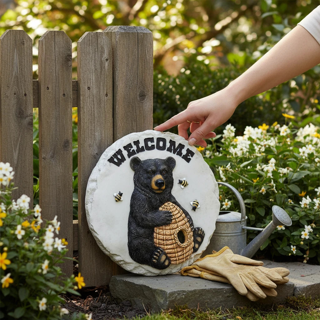 Mellow Monkey black bear welcome stepping stone plaque with bee accents, suitable for indoor or outdoor garden decor.