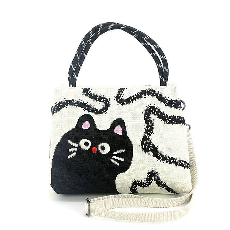 Mellow Monkey black and white polyester cat shoulder bag with top handles and an adjustable crossbody strap.