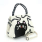 Mellow Monkey 2-piece black cat shoulder bag set in durable polyester with top handles and adjustable strap.
