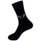 Mellow Monkey black crew socks featuring a curious black cat face with yellow eyes and pink ears
