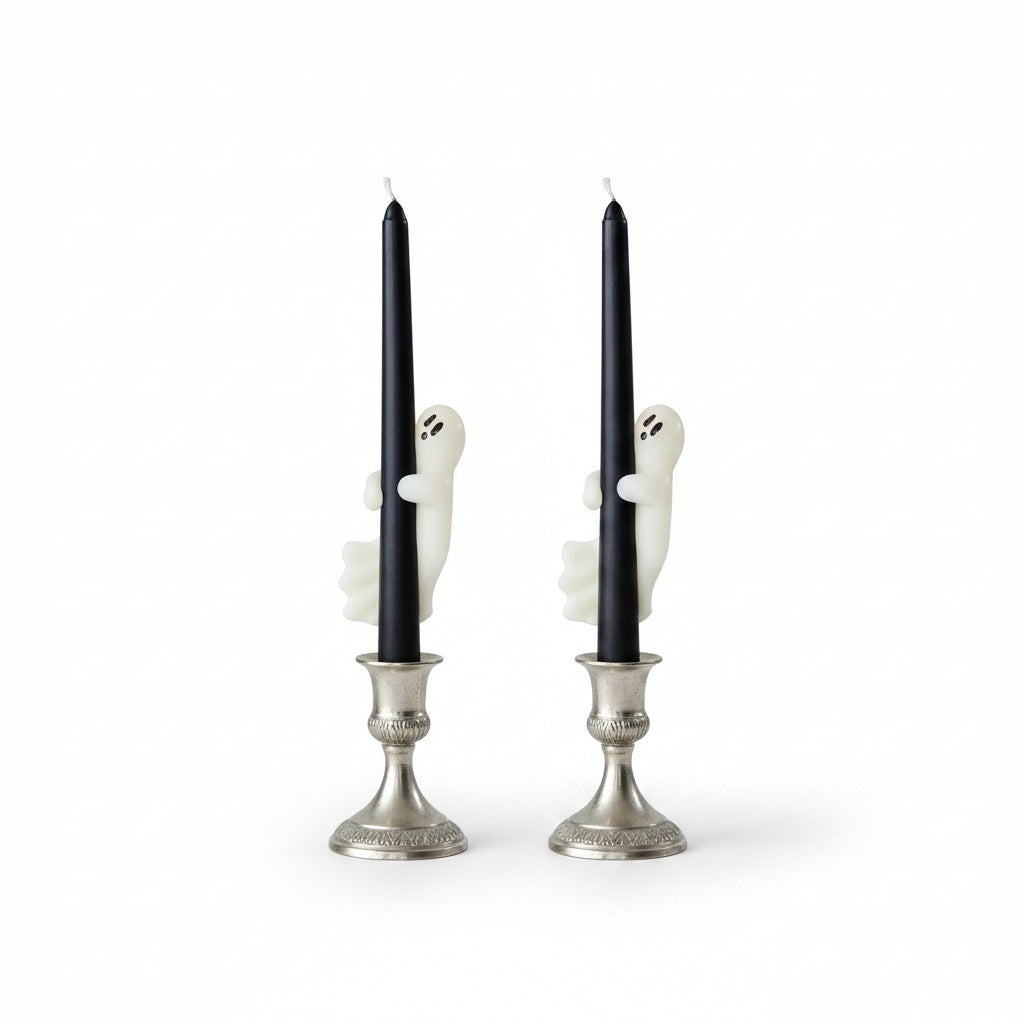 Mellow Monkey set of two black unscented taper candles featuring white ghost decorations on silver candle holders