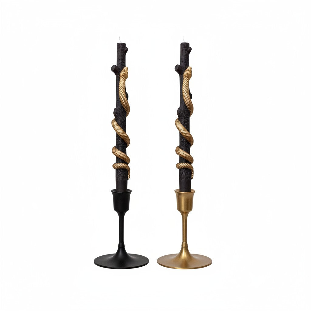Mellow Monkey set of two black twig-shaped taper candles featuring coiled gold snakes on black and gold candle holders