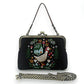 Mellow Monkey black linen kisslock bag featuring embroidered goose, cottage, and floral design with chain strap.