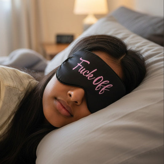 Mellow Monkey Fuck Off black satin sleep mask with pink text. Lightweight and comfortable for travel.