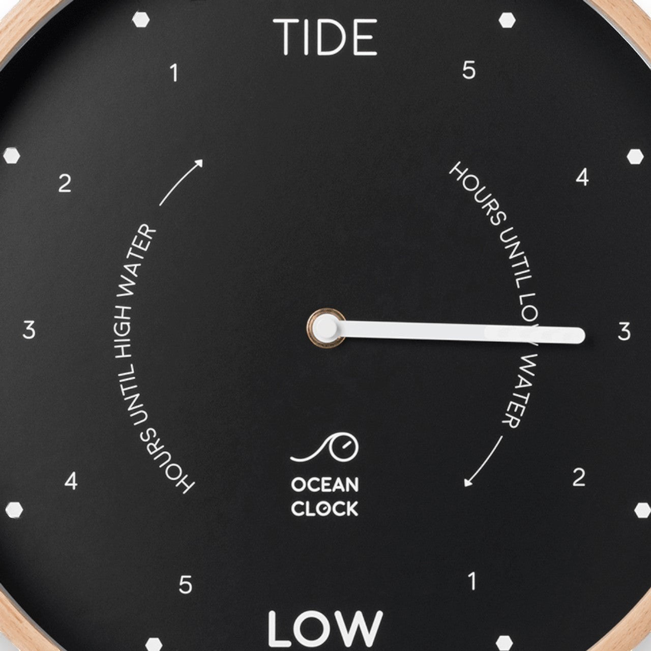 Mellow Monkey 12-inch black tide clock with a natural beech wood frame, white hands, and mineral glass face. Displays hours until high or low tide.