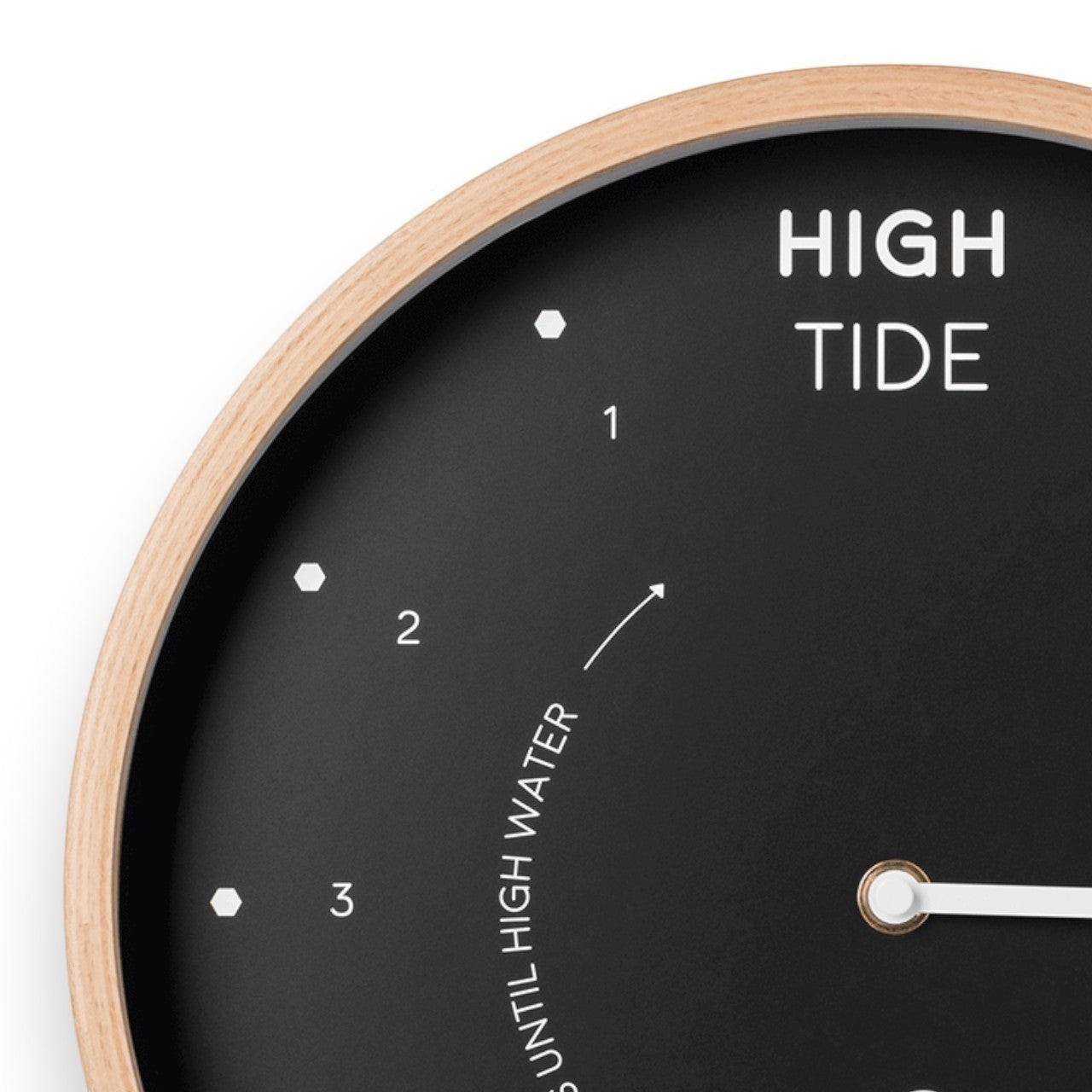 Mellow Monkey 12-inch black tide clock with natural beech frame, white hands, and mineral glass face. Displays high tide and hours until high water.