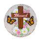 Mellow Monkey Blessed round stepping stone featuring a wooden cross, monarch butterflies, and floral accents.