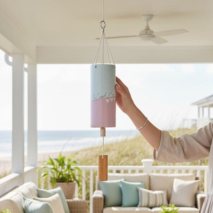 Mellow Monkey Blessed Mom wind chime with pastel pink and blue stoneware, bamboo striker, and rope hanger.