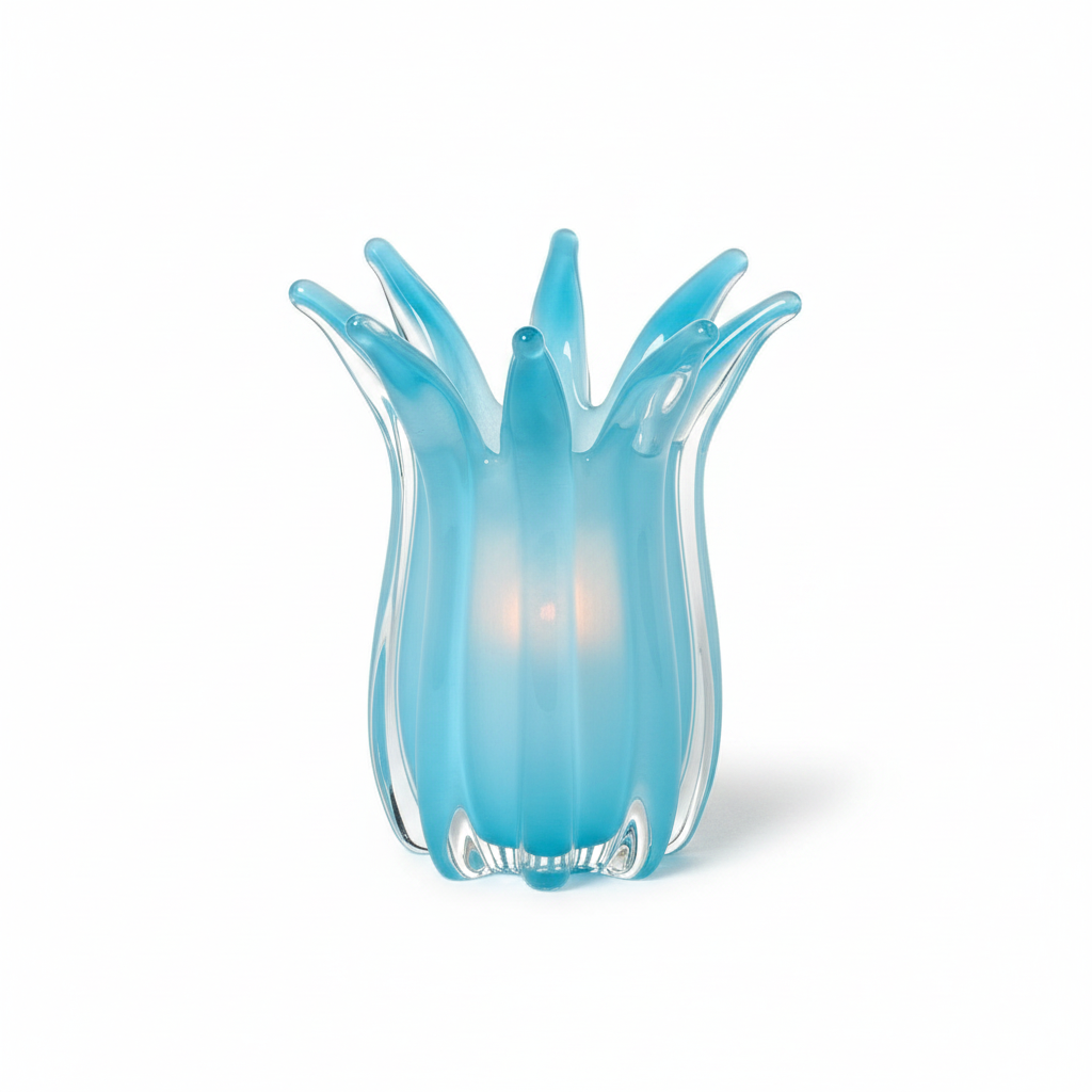 Mellow Monkey hand-blown blue art glass candle holder with a unique flower-like petal design and glowing center