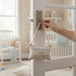 Mellow Monkey Thank Heaven for Little Boys cotton pillow door hanger with blue embroidery in a nursery setting.