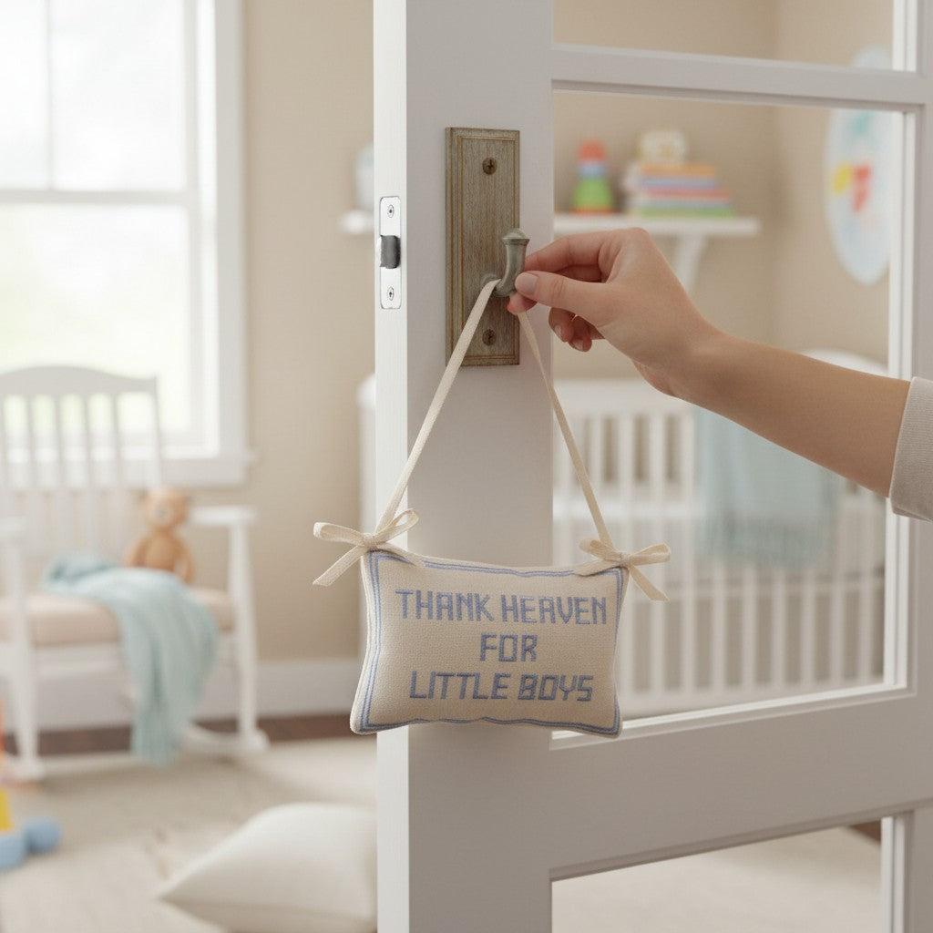 Mellow Monkey Thank Heaven for Little Boys cotton pillow door hanger with blue embroidery in a nursery setting.