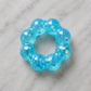 Mellow Monkey Blue Blast Feelzies Original sensory bracelet with glittery, squishy, donut-shaped design.
