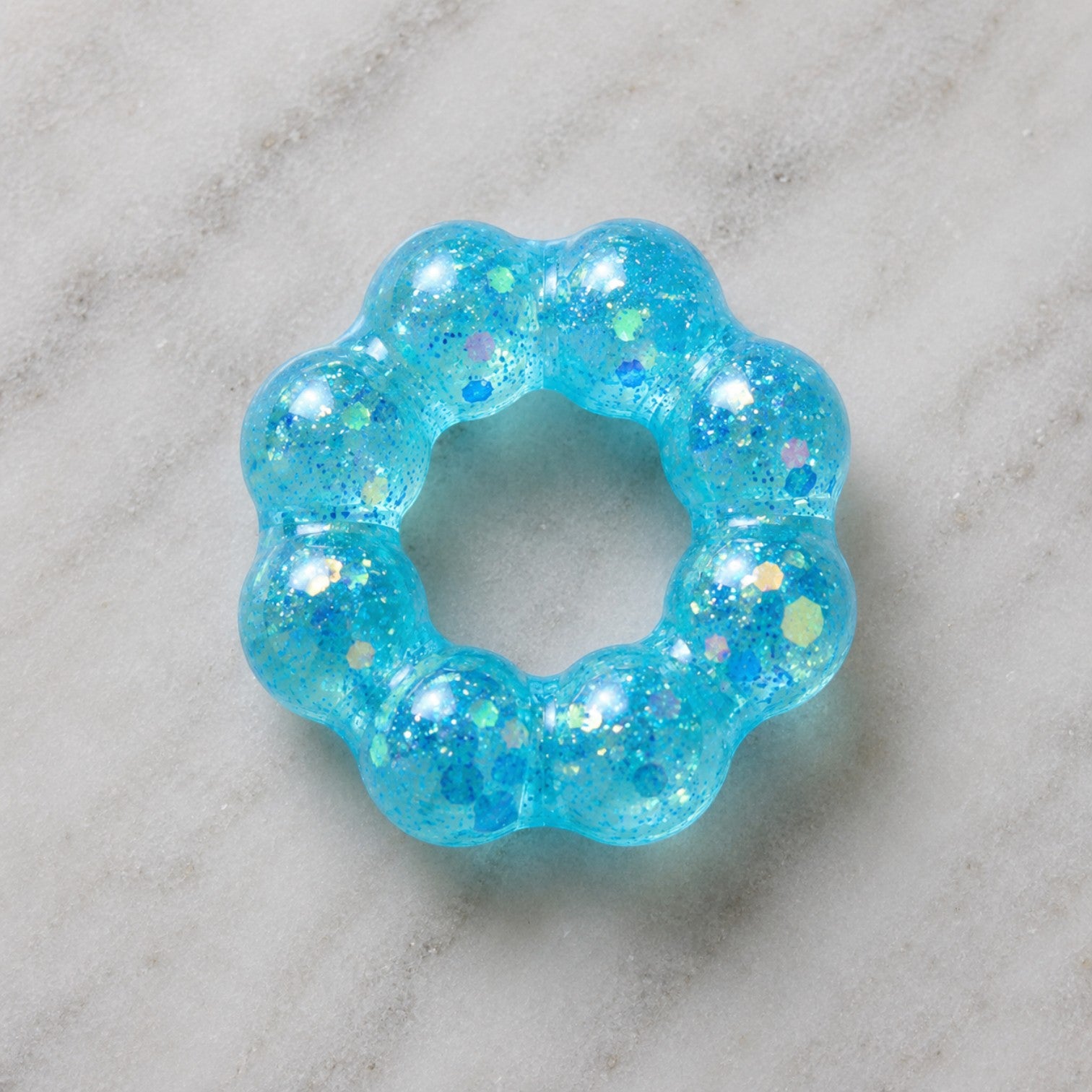 Mellow Monkey Blue Blast Feelzies Original sensory bracelet with glittery, squishy, donut-shaped design.