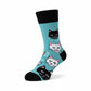 Mellow Monkey light blue crew socks featuring a repeating pattern of cartoon cat faces and the word Cats