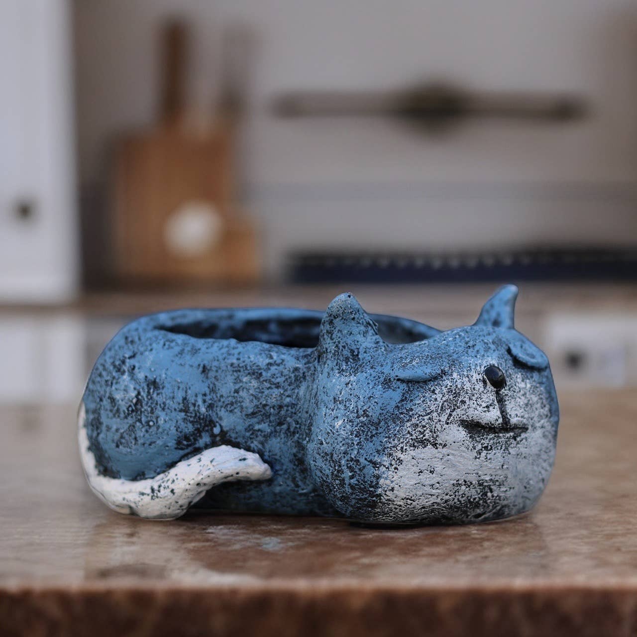 Mellow Monkey blue sleeping cat planter, handcrafted poly-resin, perfect for succulents.