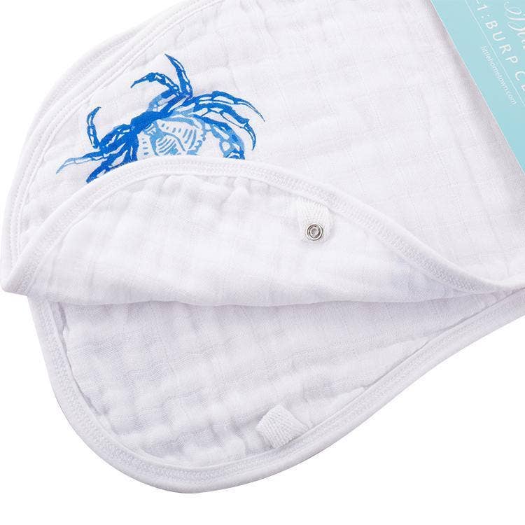 Mellow Monkey 2-in-1 white bamboo and cotton muslin burp cloth and bib with a blue crab print and metal snap closure