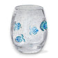 Mellow Monkey mouth-blown stemless wine glass featuring clear glass with decorative blue fish and bubble accents.