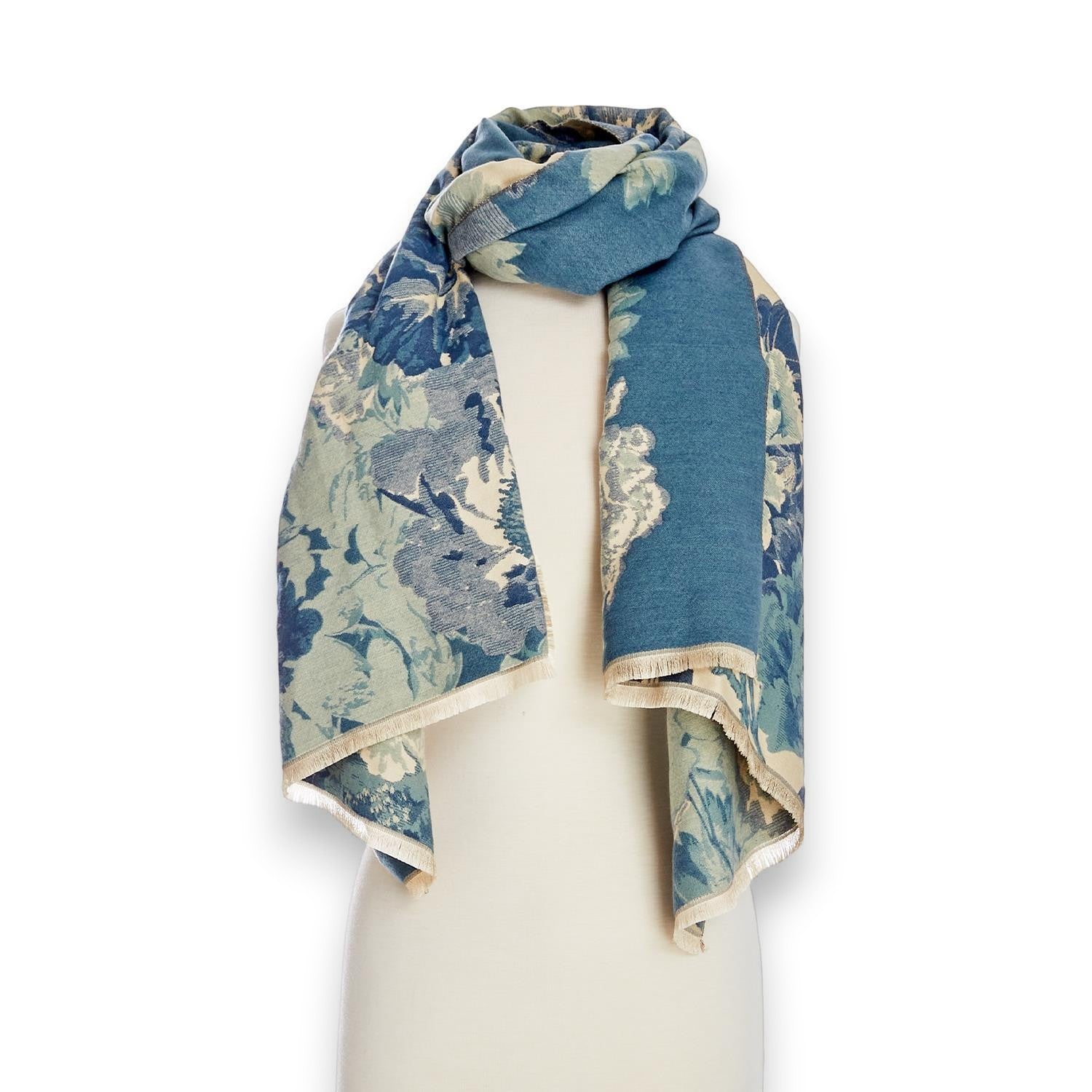 Mellow Monkey double-sided blue floral shawl scarf with soft acrylic fabric and eyelash fringe trim on a mannequin.