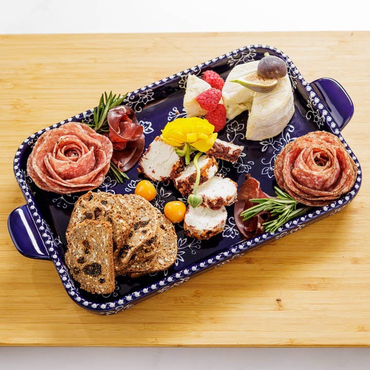 Mellow Monkey blue stoneware serving platter with floral lace pattern, styled with charcuterie and cheese board.