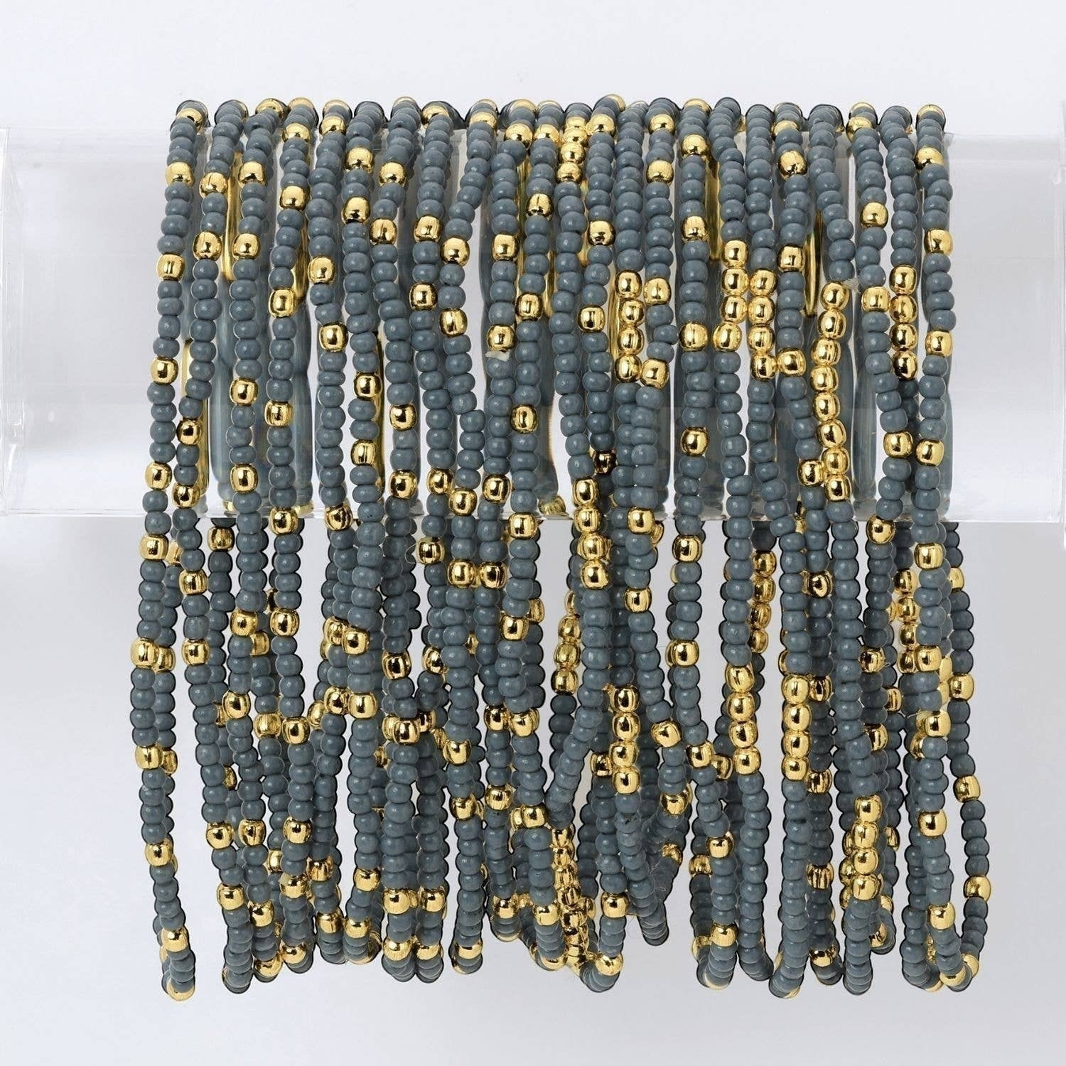 Mellow Monkey blue grey seed bead stretch bracelets with 18K gold plated brass accents for a layered stackable look.