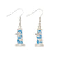 Mellow Monkey blue lighthouse drop earrings featuring starfish and seashell accents with sparkling crystals.
