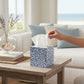 Mellow Monkey blue and white Waverly scroll papier mache tissue box cover with hand-painted gold edges on a table.