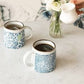 Mellow Monkey decorative ceramic coffee mug with blue and white floral pattern, perfect for tea or coffee.