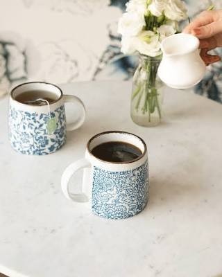 Mellow Monkey decorative ceramic coffee mug with blue and white floral pattern, perfect for tea or coffee.