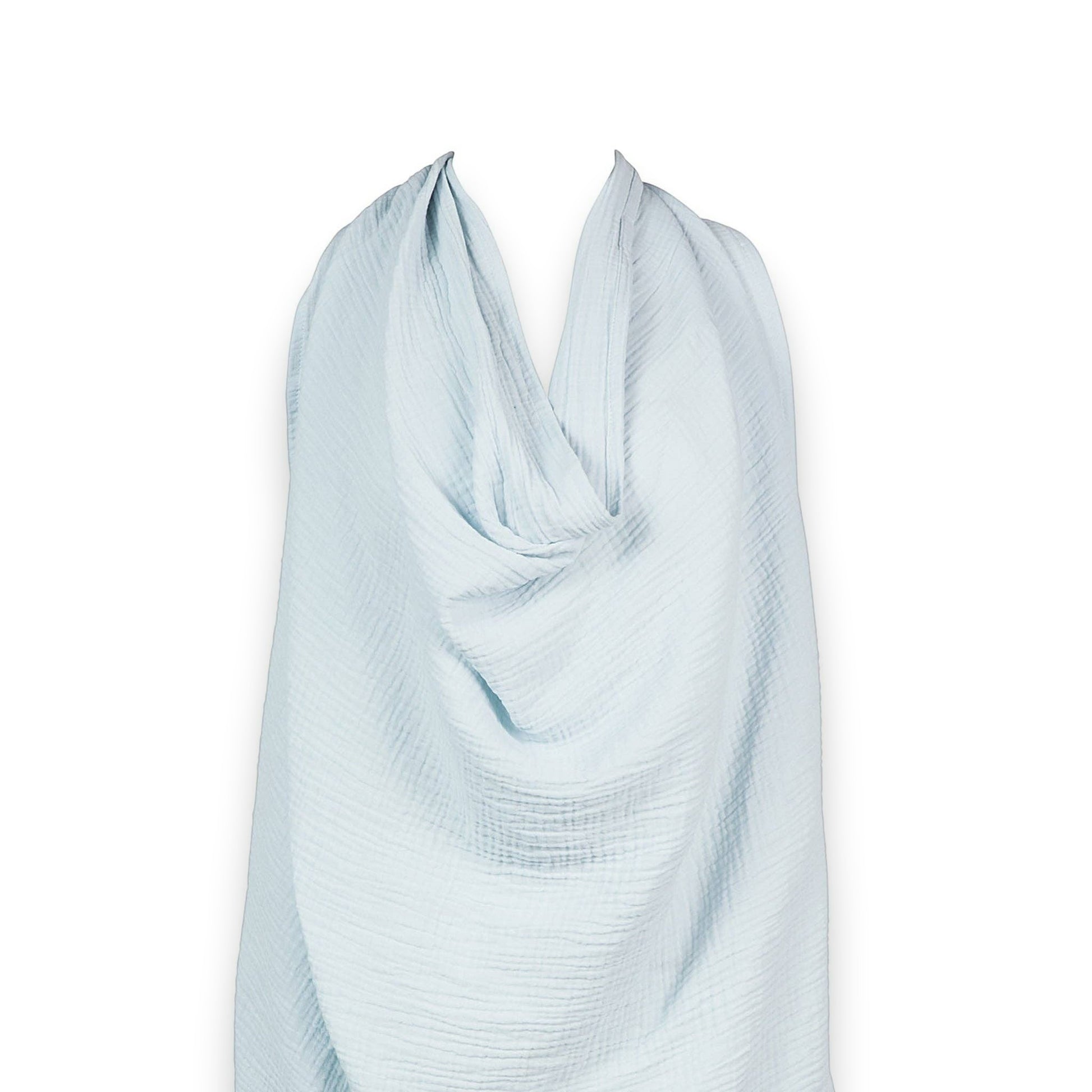 Mellow Monkey Bluebell nursing cover in soft light blue organic cotton muslin with an adjustable neckline.