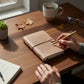 Mellow Monkey Beautiful Darling blush leather artisan journal with unlined pages and a wrap-around closure.