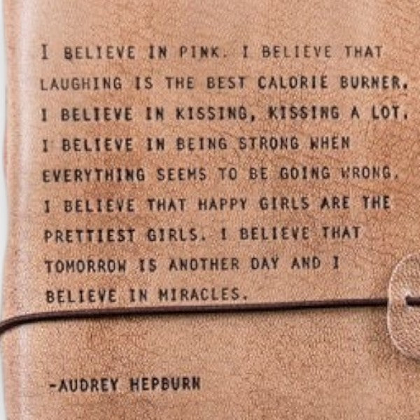 Mellow Monkey blush leather journal with Audrey Hepburn quote, acid-free pages, and strap closure.