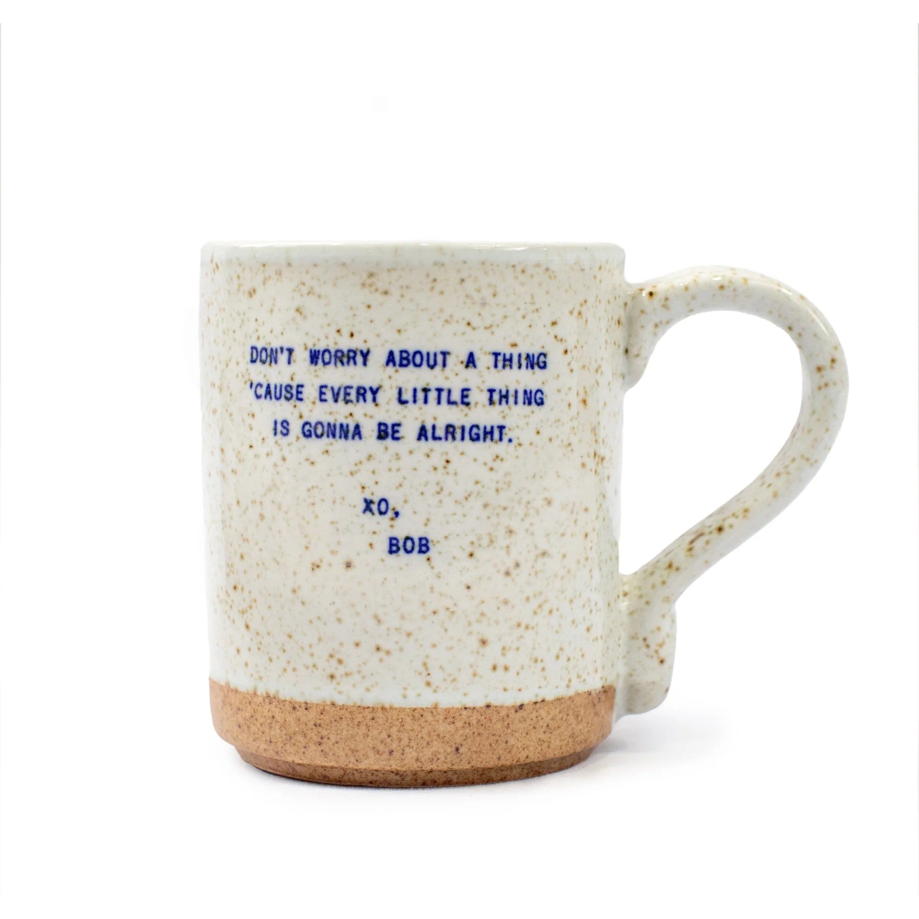 Mellow Monkey handmade ceramic mug with speckled cream glaze and blue Bob Marley quote text on a white background.