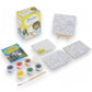 Mellow Monkey Bob Ross paint by numbers mini kit with three canvases, seven paint pots, brush, easel, and guidebook.