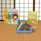 Mellow Monkey Bob Ross Happy Little Zen Garden kit with sand tray, miniature accessories, and illustrated mini book.