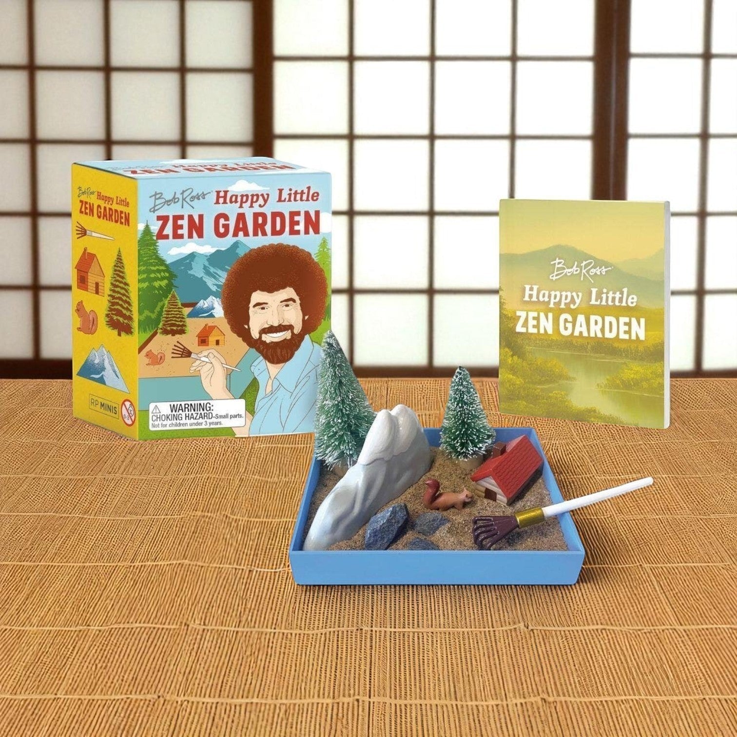 Mellow Monkey Bob Ross Happy Little Zen Garden kit with sand tray, miniature accessories, and illustrated mini book.