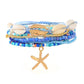 Mellow Monkey blue bohemian beaded bracelet set with seashell accents and a gold starfish charm for beach style.