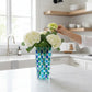 Mellow Monkey Bossanova Aqua Venetian Crystal Vase - 8" hand-painted mosaic glass with blue and green squares, holding white hydrangeas.